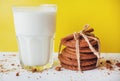 Transparent glass of milk and cookies on a white background Royalty Free Stock Photo