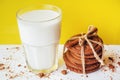 Transparent glass of milk and cookies on a white background Royalty Free Stock Photo