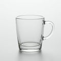 Transparent glass mug with a sturdy handle, displayed against a plain white Royalty Free Stock Photo