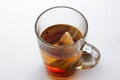 Transparent glass mug and a tea bag. A Cup of tea. Isolated on w Royalty Free Stock Photo