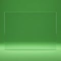 A transparent glass panel stands against a solid green background, casting subtle Royalty Free Stock Photo