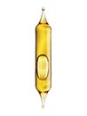 Transparent glass pipette with a Golden liquid dripping