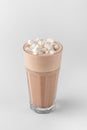 Transparent glass with raf coffee decorated by marshmallow made with espresso, frothed milk, cream, syrup and topping isolated on Royalty Free Stock Photo