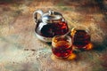 Transparent glass teapot black tea and glass cups Royalty Free Stock Photo