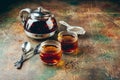 Transparent glass teapot black tea and glass cups Royalty Free Stock Photo