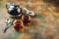 Transparent glass teapot black tea and glass cups Royalty Free Stock Photo