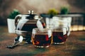 Transparent glass teapot black tea and glass cups Royalty Free Stock Photo