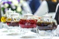 Transparent glass teapots with brewed tea