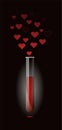 Transparent glass test tube for chemical experiments with red liquid and vapors from hearts. Valentine`s Day