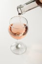 Transparent glass of wine. Pink wine. Festive mood. Alcohol for a group of friends. Delicious drink. Light background. Noble drink Royalty Free Stock Photo