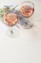 Transparent glass of wine. Pink wine. Festive mood. Alcohol for a group of friends. Delicious drink. Light background. Noble drink Royalty Free Stock Photo