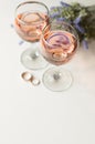 Transparent glass of wine. Pink wine. Festive mood. Alcohol for a group of friends. Delicious drink. Light background. Noble drink Royalty Free Stock Photo