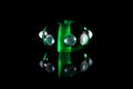 Transparent green glass bead with reflection Royalty Free Stock Photo