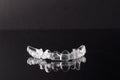 Transparent invisible dental aligners or braces aplicable for an orthodontic dental treatment