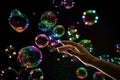The transparent, iridescent soap bubbles isolated on black. Royalty Free Stock Photo