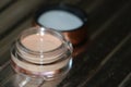 Transparent jar with concealer-an indispensable thing in makeup Royalty Free Stock Photo