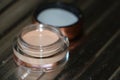 Transparent jar with concealer-an indispensable thing in makeup Royalty Free Stock Photo