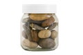 Transparent jar with different stones Royalty Free Stock Photo