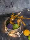 In a transparent jar, sugar colored handmade bath bombs in the form of small balls. The branch of amelo is yellow Royalty Free Stock Photo