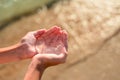 Transparent jellyfish in children`s hands.