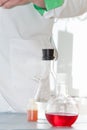 Transparent laboratory flasks with multi-colored reagents. Closeup. Selective focus Royalty Free Stock Photo
