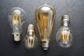 Transparent LED filament light bulbs on black background