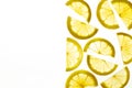 Transparent lemon slices on a white background. Top view. Copy space.