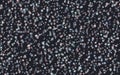 Transparent little stars of different colors on a dark background. The pattern of the night sky. Vector illustration