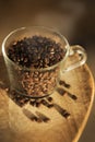 Transparent mug with coffee beans