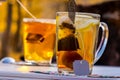 Transparent mug with tea. Brewing tea in bag Royalty Free Stock Photo