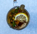 Transparent mug with tea. Brewing tea in bag. Brewing herbal tea. Herbal tea Royalty Free Stock Photo