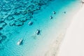 Transparent ocean and beach with fishing boats in tropical island. Aerial view Royalty Free Stock Photo