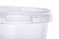 Transparent oval plastic bucket with transparent lid, plastic containers on white background, food plastic box isolated on white,