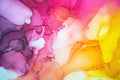 Abstract fluid art painting background in alcohol ink technique, mixture of magenta, purple and yellow paints. Royalty Free Stock Photo