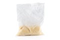 Transparent plastic bag with millet porridge on a white background. Close-up Royalty Free Stock Photo