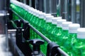 transparent plastic bottles on the conveyor belt moving very fast into water filling machine in the drinking water factory. Royalty Free Stock Photo