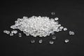 transparent plastic granules on black background.close-up. polymer industry Royalty Free Stock Photo