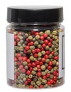 Transparent plastic jar with black lid filled with mixed multicolored peppercorns Royalty Free Stock Photo