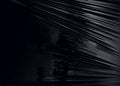 A transparent plastic wrap with a stretch on black background. Royalty Free Stock Photo