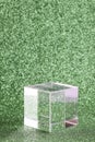 transparent podium for product display on green glittering background.