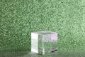 transparent podium for product display on green glittering background.