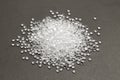 Transparent Polyethylene granules on dark .HDPE Plastic pellets. Plastic Raw material . IDPE. Royalty Free Stock Photo