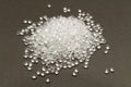 Transparent Polyethylene granules on dark .HDPE Plastic pellets. Plastic Raw material . IDPE. Royalty Free Stock Photo