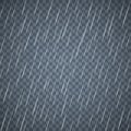 Transparent rain drops isolated on dark blue background. Dense rain with scattered water drops.