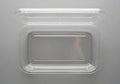 Transparent rectangular plastic container with a hinged lid, open, revealing an empty interior. The Royalty Free Stock Photo