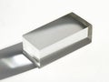 Transparent rectangular prism casting shadow on white background Royalty Free Stock Photo