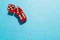 3 transparent red dice on a light blue background. Gambling and betting on the randomness of the dice. Random numbers 5, 3 and 6.