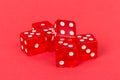 Transparent and red glass dices isolated on red background