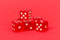 Transparent and red glass dices isolated on red background