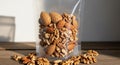A transparent, resealable plastic bag filled with mixed nuts, including almonds (Prunus Royalty Free Stock Photo